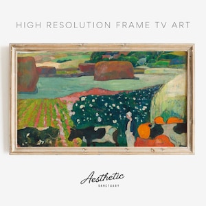 May include: A framed painting of a landscape with cows, hay bales, and a river. The painting is done in a style reminiscent of Post-Impressionism, with bold colors and brushstrokes. The frame is a simple, light wood.