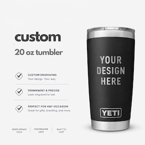 May include: A black 20 oz stainless steel tumbler with a clear lid and the YETI logo at the base. The text 'YOUR DESIGN HERE' is engraved on the front. The image includes text detailing custom engraving, dishwasher safety, and cold retention.