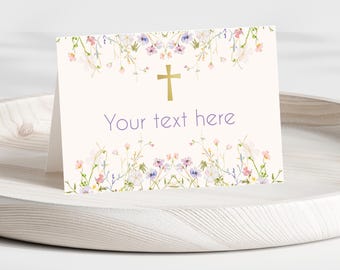 May include: A white card with a gold cross and floral border. The text "Your text here" is printed in purple.