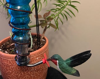 Ruby-throated hummingbird with Decorative Glass/Iron Art Feeder