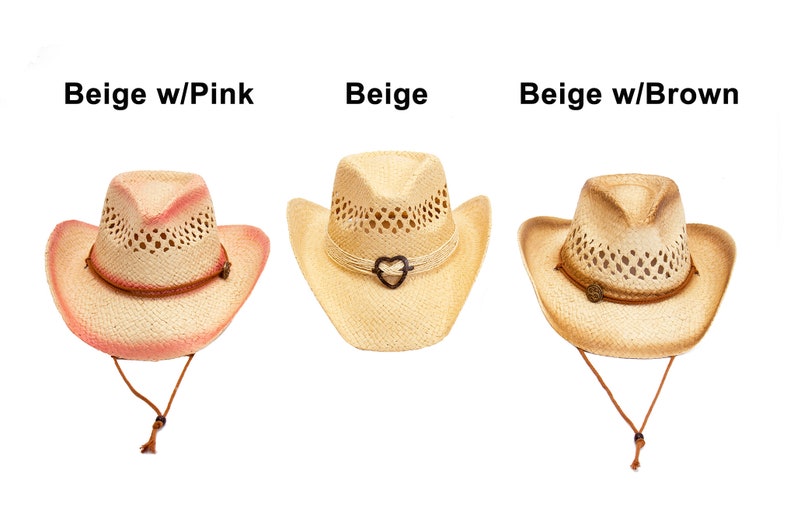 May include: Three straw cowboy hats in beige, with pink, beige, and brown accents. Each hat has a decorative band and chin strap. The hats are labeled "Beige w/Pink", "Beige", and "Beige w/Brown".