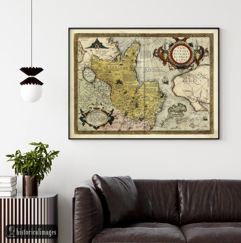 May include: A framed antique map with a black frame. The map features detailed illustrations and text in various colors, including yellow, brown, and red. The map is mounted on a white wall above a brown leather sofa. The text "historicalimages" is visible in the bottom left corner.