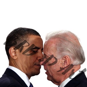 May include: Two men in suits stand close together, their faces almost touching. The man on the left has dark skin and short black hair. The man on the right has white hair and is wearing a dark suit.