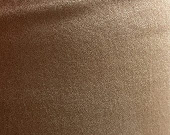 May include: Close-up of a brown fabric with a soft, fuzzy texture.