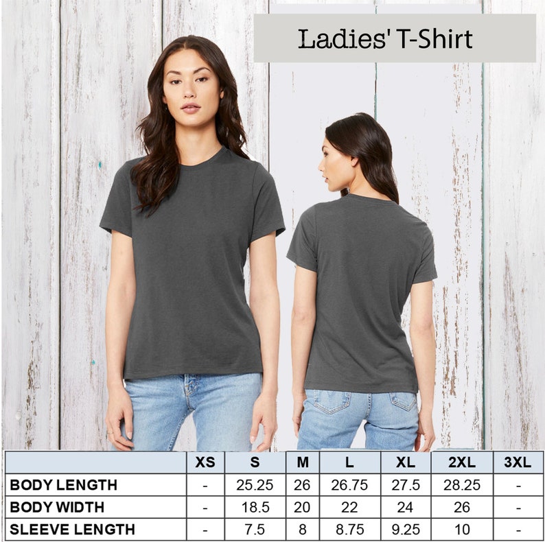 May include: Size chart for a ladies' t-shirt with measurements in inches for XS, S, M, L, XL, 2XL, and 3XL. The chart shows body length, body width, and sleeve length.