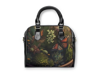 Bolso de hombro con estampado floral de mariposas y correa extraíble.
