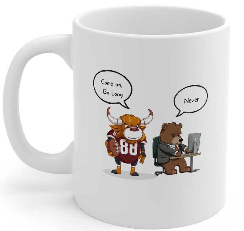 May include: White ceramic coffee mug with a cartoon bull wearing a football jersey and a bear wearing a suit sitting at a desk. The bull is saying "Come on, Go Long" and the bear is saying "Never".