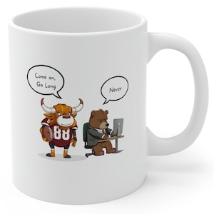 May include: White ceramic coffee mug with a cartoon bull wearing a football jersey and a bear wearing a suit. The bull is holding a football and has a speech bubble above its head that says "Come on, Go Long". The bear is sitting at a desk with a computer and has a speech bubble above its head that says "Never".