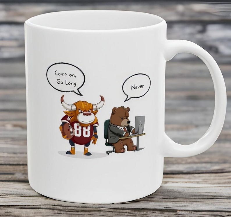 May include: White ceramic coffee mug with a cartoon bull and bear illustration. The bull is wearing a football jersey with the number 88 and holding a football. The bear is wearing a suit and sitting at a desk with a computer. The bull's speech bubble says "Come on, Go Long" and the bear's speech bubble says "Never".