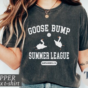 a woman wearing a goose bump t - shirt