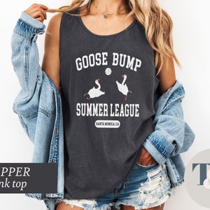 a woman wearing a black shirt with a goose bump on it