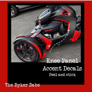 May include: Black and red Can-Am Ryker with accent decals. The knee panel and wheel accents are red. The text on the image says "Knee Panel Accent Decals Peel and stick" and "The Byker Babe".