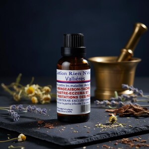 May include: A brown glass bottle with a black cap, labeled "Lotion Rien N'&eacute;tait Valli&eacute;res" in white and red text. The bottle is surrounded by dried herbs and a brass mortar and pestle on a dark slate surface.