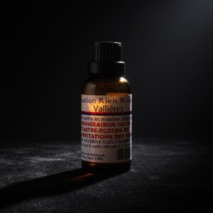 May include: A brown glass bottle with a black cap, labeled "Lotion Rien N'&eacute;c Valli&eacute;res." The label includes text about treating skin conditions like itching, eczema, and foot irritations. The bottle is on a dark surface.