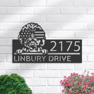 May include: Black metal address sign with a dog wearing sunglasses with a stars and stripes design. The sign displays the address "2175 LINBURY DRIVE" in a modern font, suitable for outdoor use.