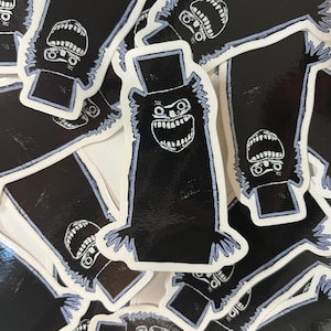The Babadook puts the B in LGBT with his dramatic style. Get your dook dook dook sticker and show off your dark horror loving side!