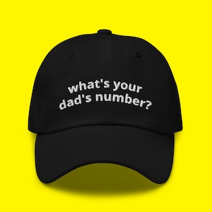May include: Black baseball cap with white embroidered text that reads "what's your dad's number?"
