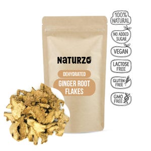May include: A brown paper pouch labelled Naturzo Dehydrated Ginger Root Flakes with a pile of dried, tan ginger pieces in the foreground. The packaging features icons stating 100% Natural, No Added Sugar, Vegan, Lactose Free, Gluten Free, and GMO Free.