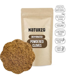 May include: A tan pouch labeled Naturzo Dehydrated Powdered Cloves with a flower-shaped pile of brown spice powder in front. To the right, a vertical column of six circular icons lists 100% Natural, No Added Sugar, Vegan, Lactose Free, Gluten Free, and GMO Free.