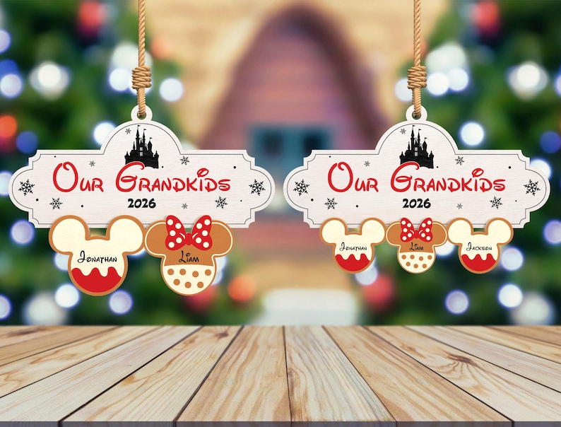 May include: Two wooden Christmas ornaments with the text "Our Grandkids 2026". Each ornament has a Mickey Mouse head and a Minnie Mouse head. The names Jonathan, Liam, and Jackson are written on the ornaments.