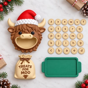 May include: A brown highland cow head wearing a red Santa hat, a beige sack labeled "TREATS FOR MOO" with a cow icon, a green rectangular tray, and twenty-six circular beige tokens featuring lowercase letters of the alphabet.