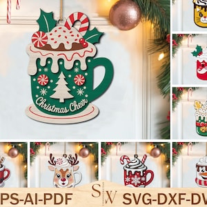 May include: Wooden Christmas ornament in the shape of a green mug with a white rim, topped with whipped cream, a candy cane, and holly. The mug has a Christmas tree and the words "Christmas Cheer". Other Christmas mug ornaments are also shown.
