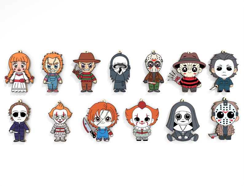 May include: A collection of cartoon-style horror movie character ornaments. The ornaments feature characters like Annabelle, Chucky, Freddy Krueger, and Michael Myers. Each ornament is brightly colored and has a small loop at the top for hanging.