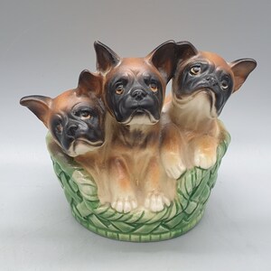 Vintage Japanese Porcelain Sculpture of a Three Boxer Puppies In a Dog Bed Looking Up | Made In Japan