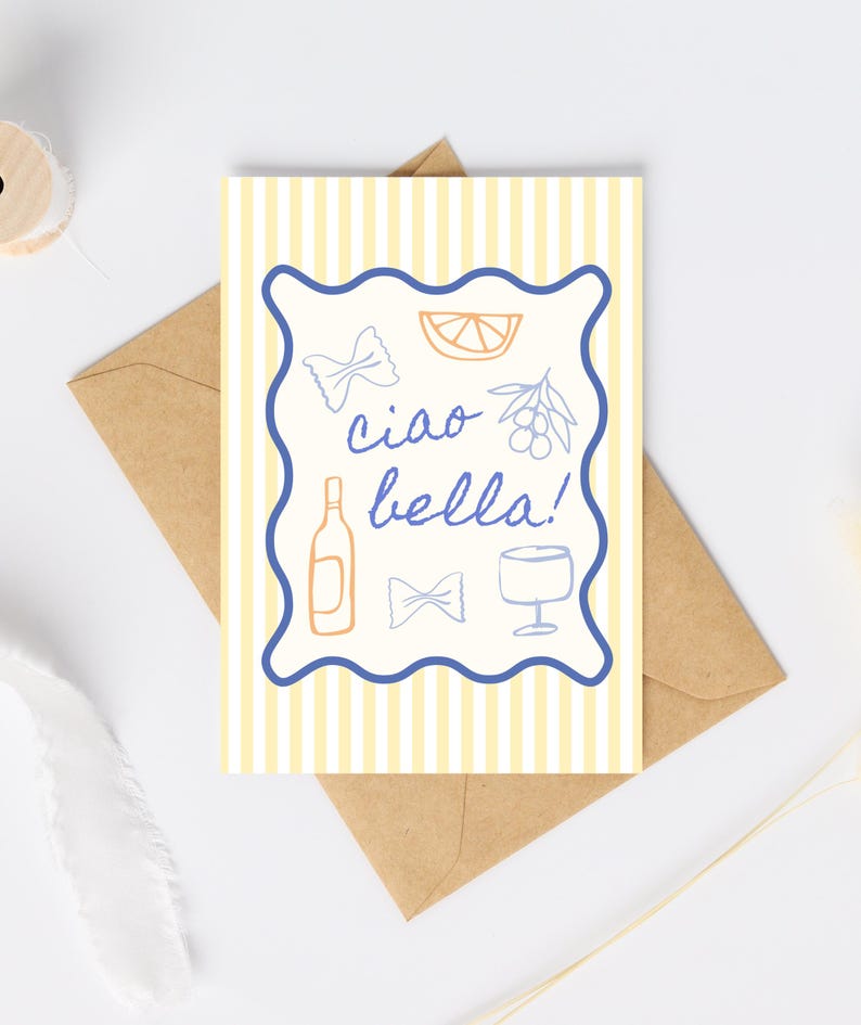 May include: Greeting card with a yellow and white striped background, a blue border, and the words "ciao bella!" in blue script. The card features illustrations of pasta, a lemon slice, olives, a wine bottle, a bow tie, and a wine glass. The card is inside a brown envelope.