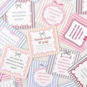 May include: A collection of pastel-colored book club discussion prompt cards. Each card features a unique question, decorative borders, and bow accents. The cards are designed with striped backgrounds in pink, blue, and gray.