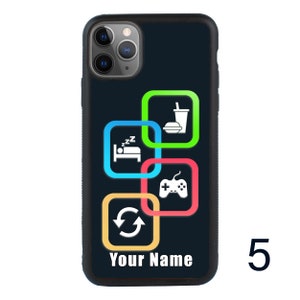May include: A black iPhone case with a colorful design featuring icons for sleep, food, gaming, and a repeat symbol. The text "Your Name" is printed at the bottom of the case.
