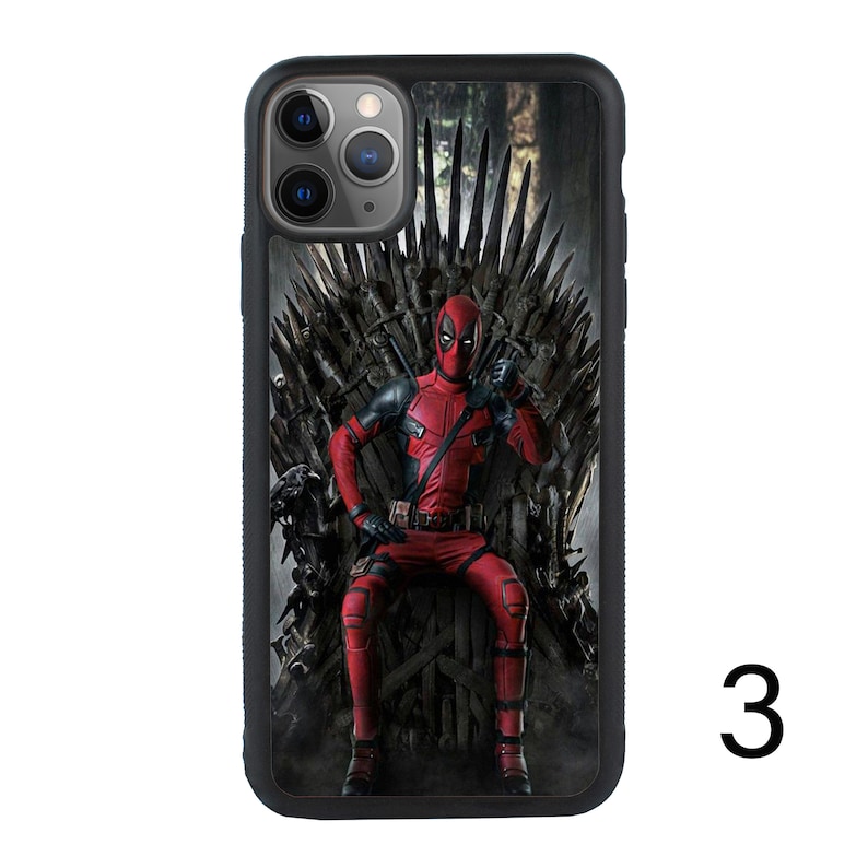 May include: A black iPhone case with a printed image of Deadpool sitting on the Iron Throne from Game of Thrones. The image is in a comic book style.