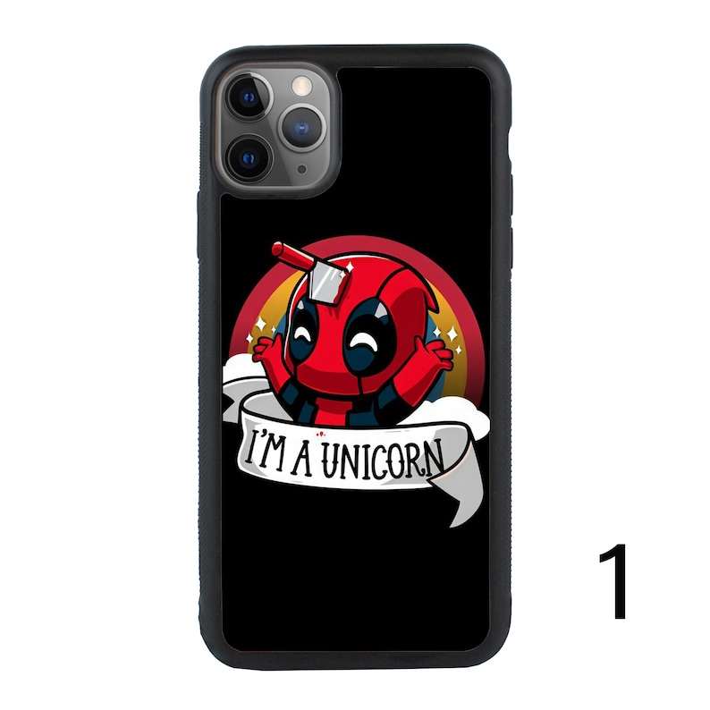 May include: Black phone case with a cartoon image of Deadpool wearing a unicorn horn and a red and blue costume. The text "I'm a unicorn" is on a banner below the image.