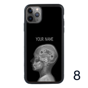 May include: Black phone case with a white outline of a head with a video game controller inside. The text "YOUR NAME" is printed on the case.