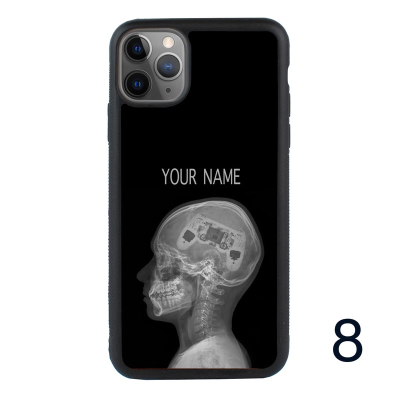 May include: Black phone case with a white outline of a head with a video game controller inside. The text "YOUR NAME" is printed on the case.