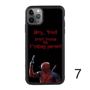 May include: Black phone case with a red Deadpool character holding a gun and the text "Hey... YOU! Don't touch my F*CKING PHONE!"