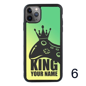 May include: A green and yellow gradient phone case with a black silhouette of a video game controller and crown. The text "KING YOUR NAME" is printed on the case.