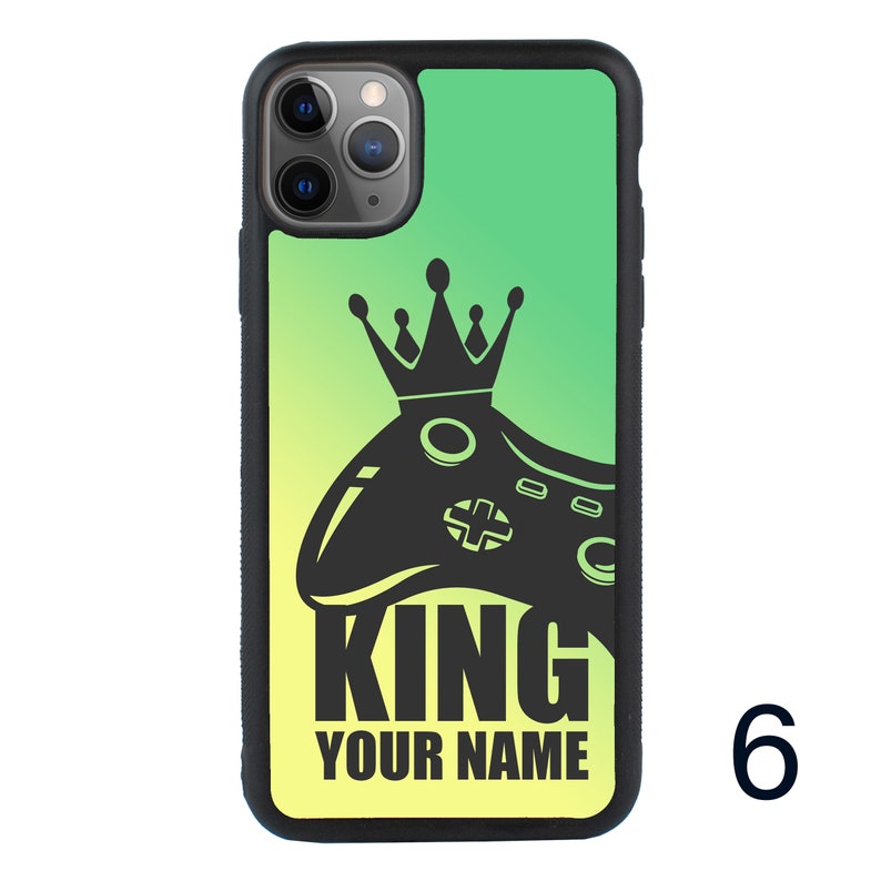 May include: A green and yellow gradient phone case with a black silhouette of a video game controller and crown. The text "KING YOUR NAME" is printed on the case.