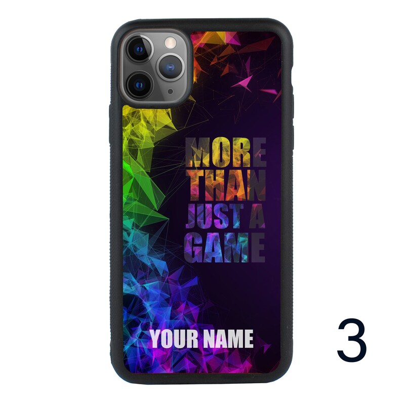 May include: A black phone case with a colorful geometric design and the text "More Than Just A Game" and "Your Name".