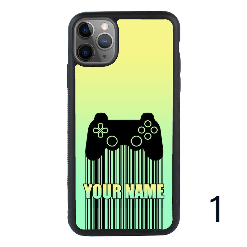 May include: A black phone case with a green and yellow gradient background. A black video game controller is printed on the case, with a barcode underneath it. The text "YOUR NAME" is printed on the barcode.