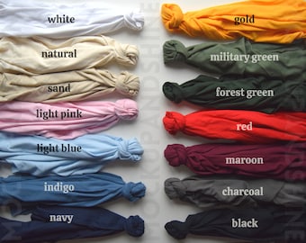 May include: A variety of t-shirt colors, including white, natural, sand, light pink, light blue, indigo, navy, gold, military green, forest green, red, maroon, charcoal, and black.