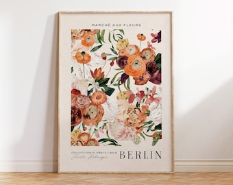 May include: A framed floral print featuring a beige backdrop and an assortment of flowers in orange, red, pink, and white. The print includes the text "MARCHÉ AUX FLEURS" and "BERLIN". The words "FRAME NOT INCLUDED" are at the top.