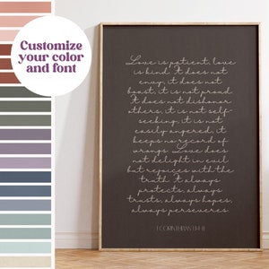 May include: A framed print with a dark gray background features white script text from 1 Corinthians 13:4-8. The text describes love's qualities. A color palette of muted tones is shown on the left, with the text "Customize your color and font."