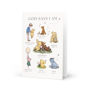 May include: A folded greeting card featuring illustrations of Winnie the Pooh and friends. The card includes the text "GOD SAYS I AM" with various character depictions and associated words like "Protected" and "Peaceful".