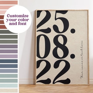 May include: A beige canvas print with black numbers "25. 08. 22" in a bold, stylised font. The text "Your names or text here" is written in a smaller font below the numbers.