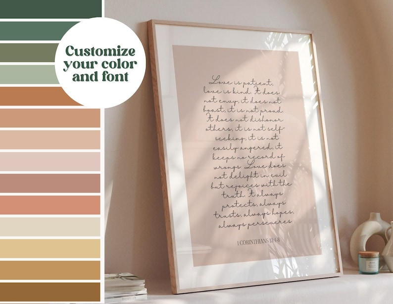 May include: Framed print with the text "Love is patient" in elegant script. The artwork features a soft pink background and a wooden frame. The image also includes a color palette with options to customize the color and font.