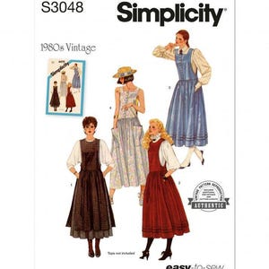 May include: A Simplicity S3048 sewing pattern envelope featuring illustrations of four different pinafore styles. The designs include a dark patterned pinafore, a floral print pinafore with a hat, a solid blue pinafore, and a solid red pinafore, all worn over blouses.