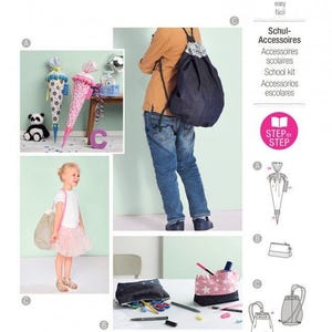 Op de afbeelding: Een Burda Kids naaipatroon-envelop voor schoolaccessoires, model 9256. De hoes toont illustraties en foto's van een rugzak met trekkoord, een etui en een kegelvormige cadeautas, met tekst waaronder 'burda kids' en '9256'.