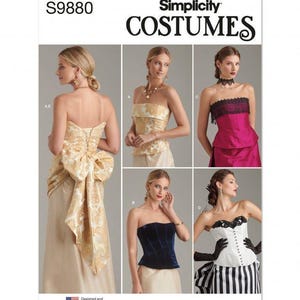 May include: Simplicity Costumes pattern S9880 features five strapless corset-style tops. Designs include a gold brocade top with a large back bow, a dark blue velvet corset, a magenta top with black lace trim, and a white corset with black lace.