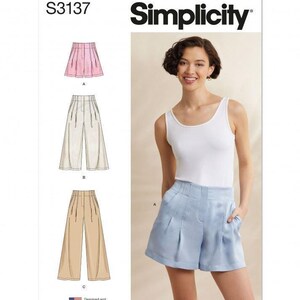 May include: Simplicity sewing pattern S3137 featuring illustrations of pleated shorts and wide-leg trousers in pink, beige, and tan. The cover displays a white tank top paired with light blue pleated shorts, including the text Simplicity and S3137.